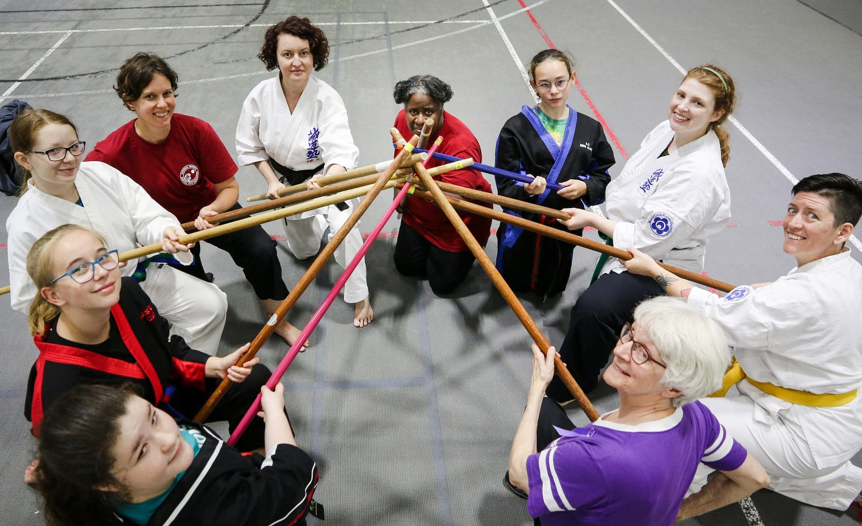 group holidng staffs in circle