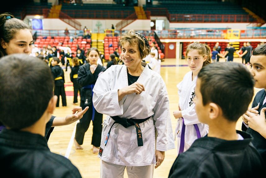 Jill Shames leading a group of youth attendees learning Judo
