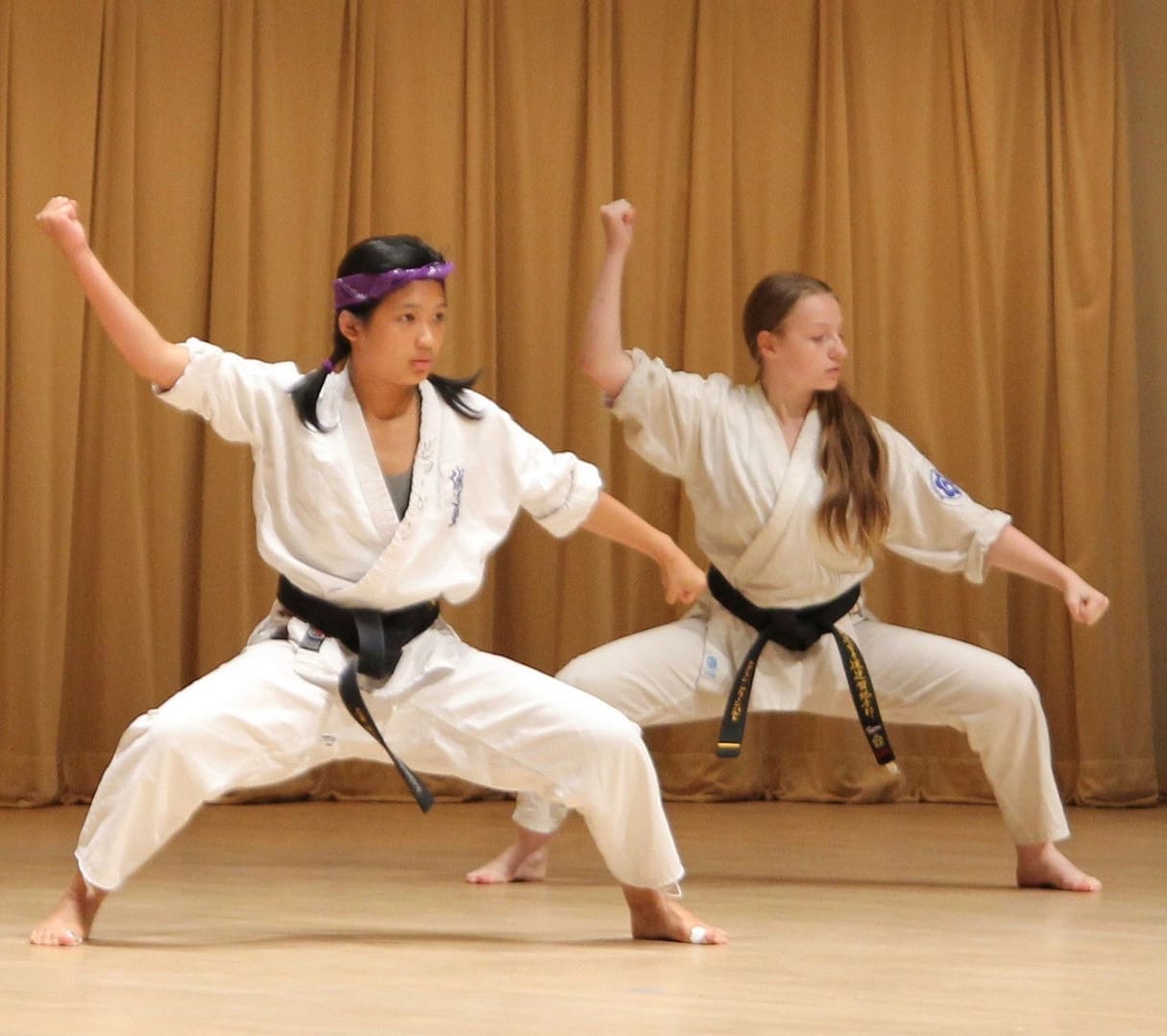 two youth performing a karate form in the super Saturday Showcase.