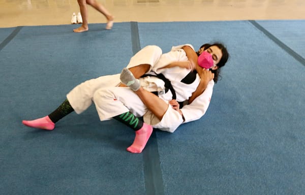 judokas grappeling on a mat